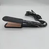A black and rose gold Remington Proluxe hair straightener is shown on a white background with its cord coiled behind it. Anteprima dell’immagine prodotto