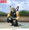 A figure of Tengen Uzui from Demon Slayer is crouching on a textured surface with a blurred background of trees and sky. Náhľad obrázku produktu