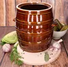 A ceramic pot for pickling and preserving food, surrounded by ingredients like cabbage, garlic, dill, and pickles. Voir les images du produit