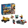 A LEGO City mining team playset is shown with its packaging and some of the assembled pieces. Produktbild-Vorschau
