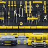 A wall-mounted tool organizer with various tools and storage bins. Voir les images du produit