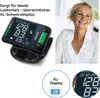 A collage showing a wrist blood pressure monitor and a smiling woman. Anteprima dell’immagine prodotto