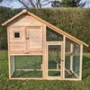 A wooden chicken coop with a wire mesh enclosure is set up on a grassy lawn. Produktbild-Vorschau