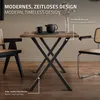 A dining table with two chairs in a modern dining room setting. Podgląd zdjęcia produktu