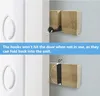 A split image showing a wooden hook that folds back into its unit to prevent hitting a door. Produktbild-Vorschau