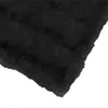 A close-up view of a black faux fur blanket. Podgląd zdjęcia produktu
