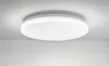 A white, round, flat LED ceiling light mounted on a white ceiling. Podgląd zdjęcia produktu