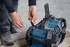 A person is plugging a USB cable into a portable radio. Produktbild-Vorschau