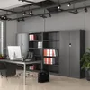 An office setting with a desk, computer, filing cabinets, and chairs. Anteprima dell’immagine prodotto