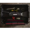 A top-down view of an open black toolbox filled with various tools. Anteprima dell’immagine prodotto