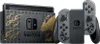 A Nintendo Switch console with dock and Joy-Con controllers, featuring a Monster Hunter Rise theme. Náhled obrázku produktu