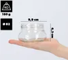 A hand holding a glass jar with dimensions indicated by lines and text. Náhľad obrázku produktu