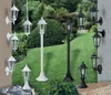 A collection of outdoor lamps displayed in a garden setting. Produktbild-Vorschau