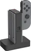 A Nintendo Switch Joy-Con charging dock with a Joy-Con controller inserted. Anteprima dell’immagine prodotto