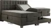 A dark gray boxspring bed with an adjustable headrest and footrest, shown from a side-diagonal angle. Produktbild-Vorschau