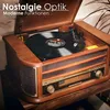 A vintage-style record player with a vinyl record playing. Produktbild-Vorschau