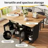 A kitchen island with storage, featuring a wooden countertop and black cabinets with glass doors. The island is set in a kitchen environment with a window in the background. Produktbild-Vorschau