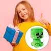 A young girl is holding a gift and giving a thumbs up, with a plush toy inset. Produktbild-Vorschau