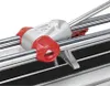 Close-up view of a tile cutting machine's cutting head and guide rails. Podgląd zdjęcia produktu