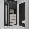 A modern entryway with a dark wood door and a built-in storage unit with drawers and shelves. Produktbild-Vorschau