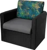 A black rattan armchair with gray seat and back cushions, and a decorative pillow with a tropical leaf pattern. Produktbild-Vorschau