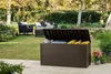 An outdoor patio scene with a brown storage box filled with yellow items and some white items, with outdoor furniture and plants in the background. Podgląd zdjęcia produktu