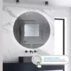 A modern bathroom with a round LED mirror, marble walls, and a dark vanity. Produktbild-Vorschau