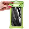 A hand is shown opening a green waterproof case for a phone. Produktbild-Vorschau
