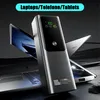 A power bank is shown in front of two laptops, suggesting its use for charging devices. Produktbild-Vorschau