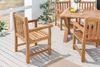A wooden garden table and chairs set on a wooden deck. Produktbild-Vorschau