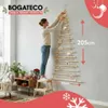 A woman is decorating a wall-mounted Christmas tree made of wood. Anteprima dell’immagine prodotto