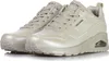 A pair of beige Skechers sneakers are shown from a slightly angled front view against a white background. Voir les images du produit