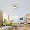 A modern living room with a stylish ceiling lamp, a yellow armchair, and a sofa. Anteprima dell’immagine prodotto