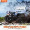 A light blue Jeep is driving through mud and water, with a winch mounted on the front. Náhled obrázku produktu