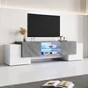 A modern TV stand with a television on top, set in a clean, well-lit room. Anteprima dell’immagine prodotto