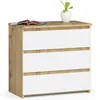 A modern chest of drawers with a wood-grain frame and white drawers, topped with a book and a small potted plant. Produktbild-Vorschau