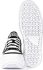 A pair of black and white Converse sneakers, shown from the front and underneath. Voir les images du produit