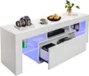 A white TV cabinet with LED lighting, displaying various items on and inside it. Produktbild-Vorschau