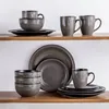 A display of a dinnerware set on wooden shelves. Produktbild-Vorschau