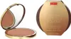 A bronzing powder compact and its packaging are displayed side-by-side on a white background. Anteprima dell’immagine prodotto