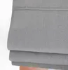 A close-up view of folded grey fabric, likely a roman blind. Produktbild-Vorschau