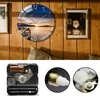 A collage of a wall clock with a scenic image and close-ups of its internal mechanism. Voir les images du produit