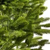 A close-up view of green artificial Christmas tree branches. Produktbild-Vorschau