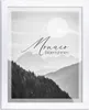 A black and white landscape photo with text overlay, framed by a white border. Produktbild-Vorschau