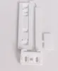 A white plastic product component, possibly a door mounting kit for a refrigerator, is laid out on a white background. Produktbild-Vorschau