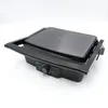 A close-up, angled view of a black electric grill on a white background. Voir les images du produit