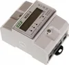 A close-up, slightly angled view of a white and gray three-phase energy meter. Produktbild-Vorschau