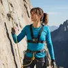 A woman rock climbing on a cliff face. Náhľad obrázku produktu
