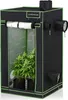 A black and green grow tent with plants inside. Podgląd zdjęcia produktu