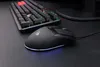 A black gaming mouse and keyboard are shown on a black surface. Produktbild-Vorschau